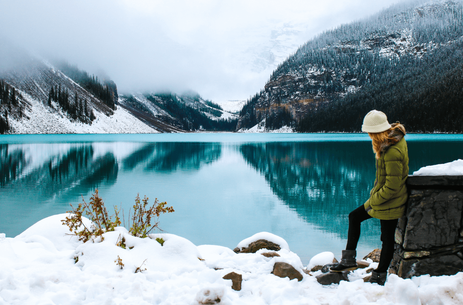 Photo of a woman on a Canadian lake background in winter